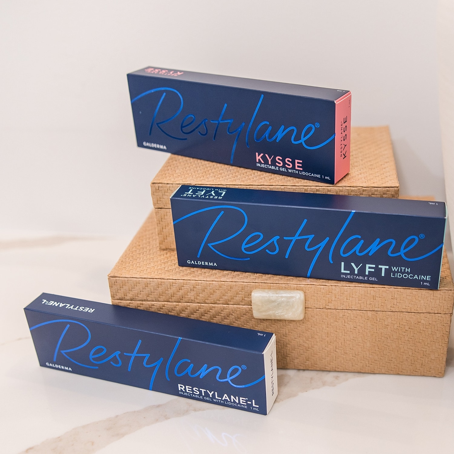 Restylane injectable gel products stacked on box.