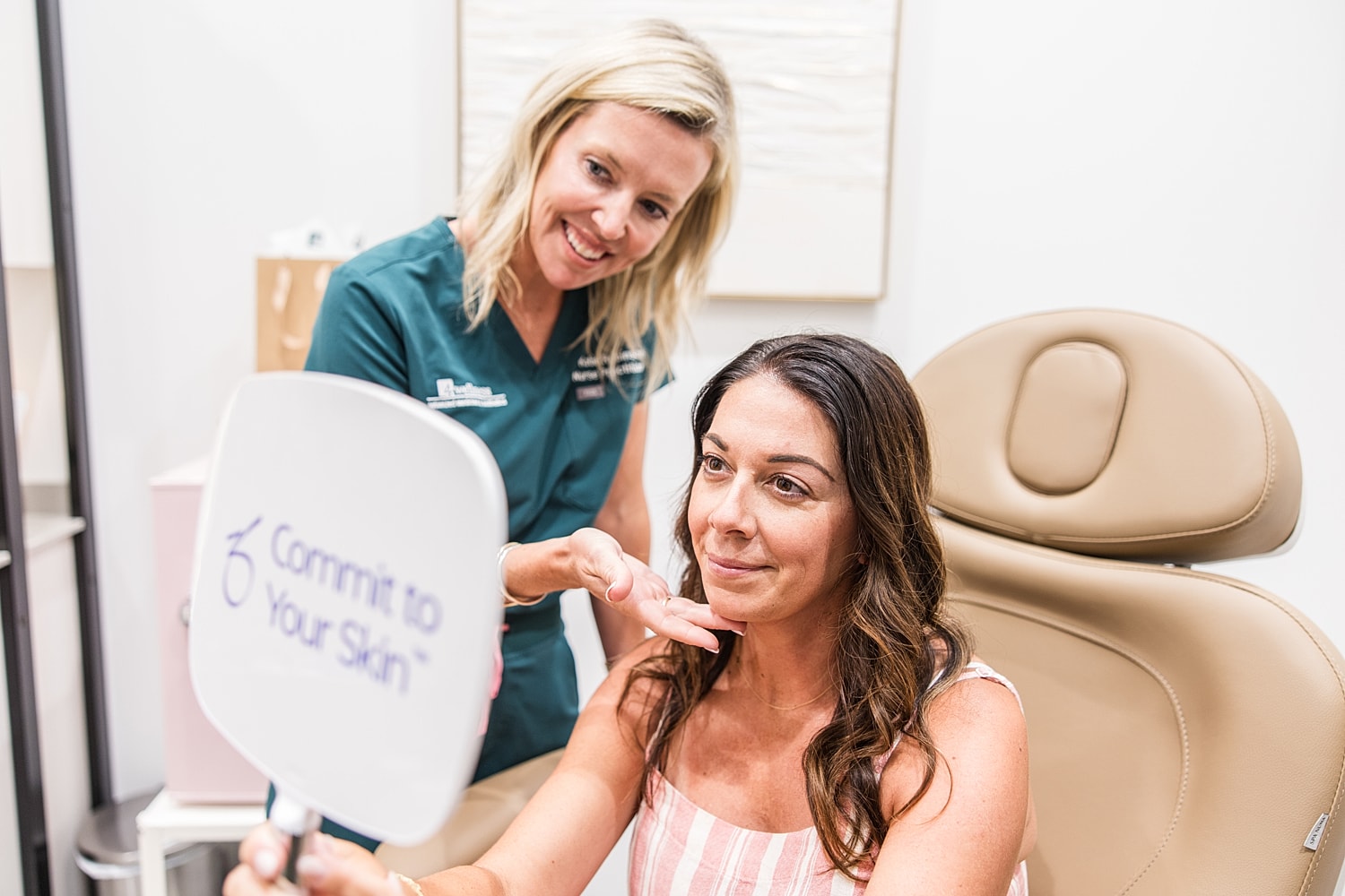 Consultation for skincare treatment in clinic setting.