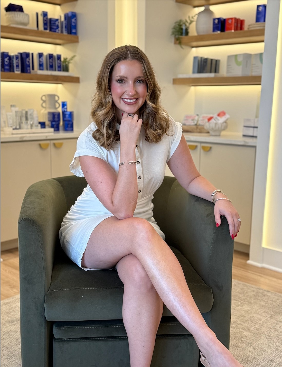 Woman sitting gracefully in a stylish spa.
