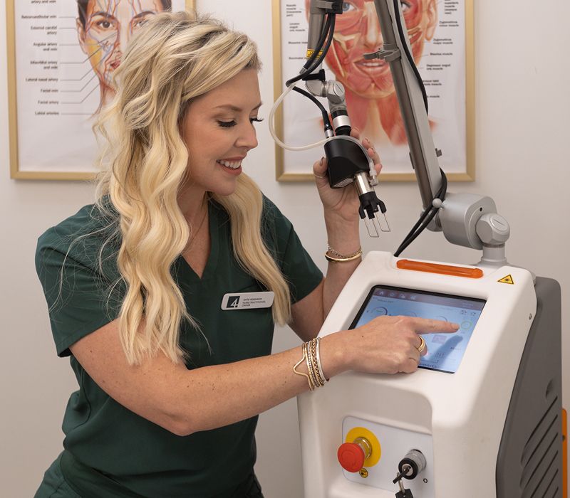 Woman using advanced skin treatment equipment.