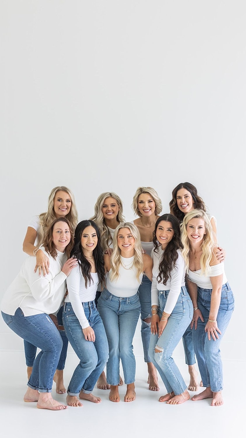 Woman smiling with long hair and natural makeup.